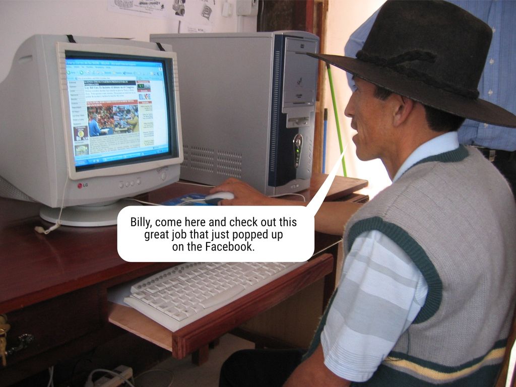 old man sitting at an old computer getting excited